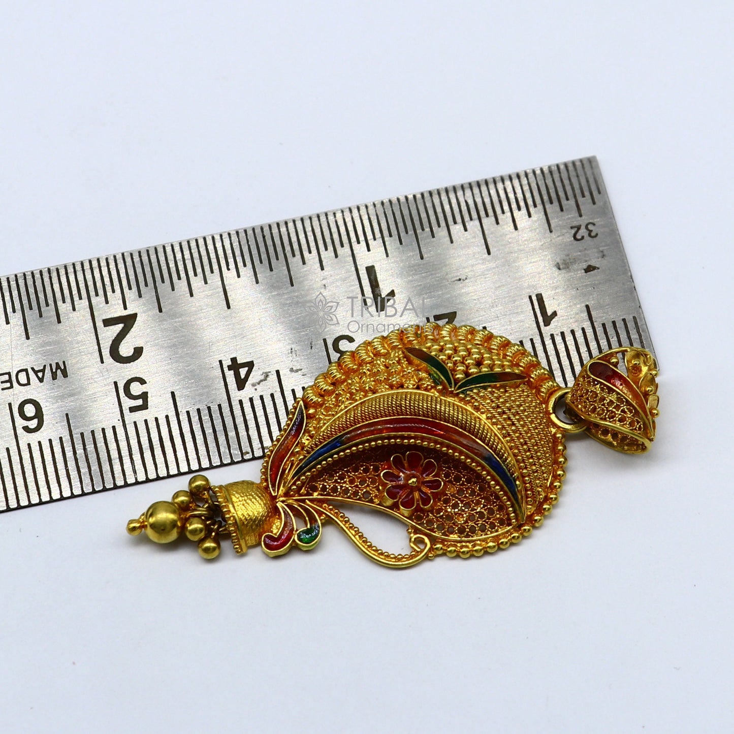 Handcrafted 22KT yellow gold traditional filigree pendant, ethnic bridal jewelry, detailed design, unique cultural craftsmanship.