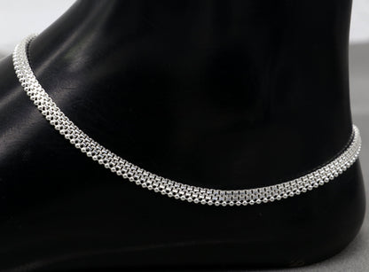 Handmade 4mm sterling silver ankle bracelet by TRIBAL ORNAMENTS, featuring a delicate chain and foot jewelry design.