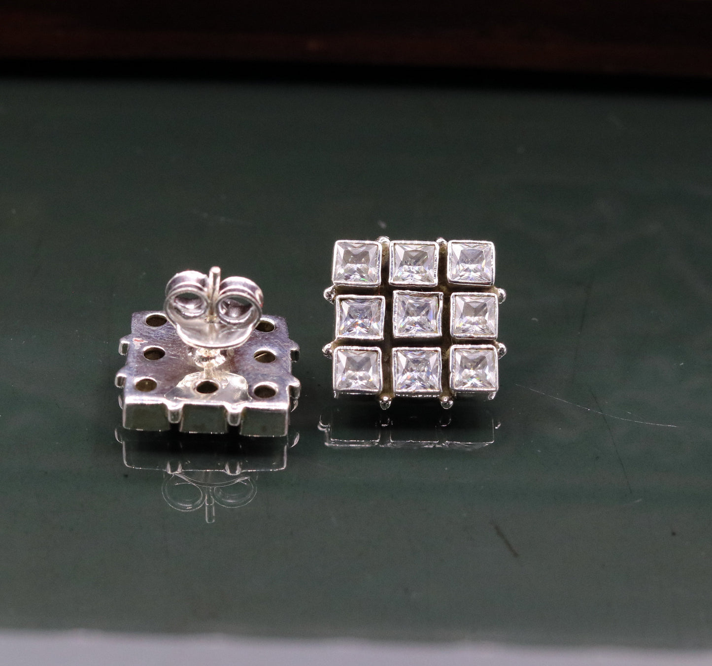 Handmade sterling silver cubic zirconia stud earring with a pendant from TRIBAL ORNAMENTS, ideal for gifting or stylish wear.