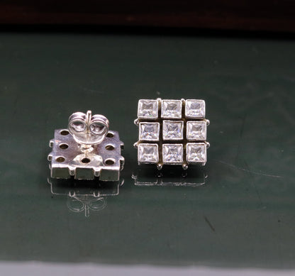 Handmade sterling silver cubic zirconia stud earring with a pendant from TRIBAL ORNAMENTS, ideal for gifting or stylish wear.