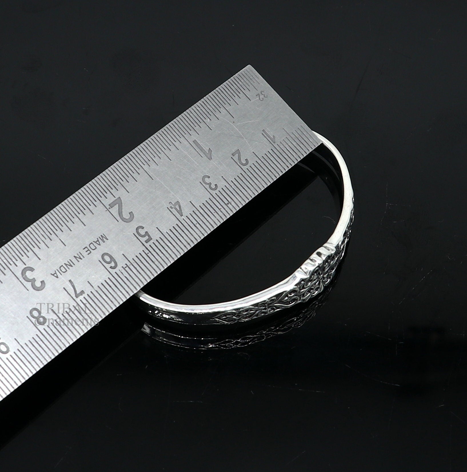Unisex 925 sterling silver open face cuff bracelet with intricate tribal design, handmade Indian jewelry by TRIBAL ORNAMENTS.
