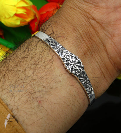 Sterling silver open face cuff bracelet by Tribal Ornaments, unisex handmade Indian jewelry with detailed design.