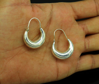 Sterling silver handmade tribal hoops earrings by TRIBAL ORNAMENTS, vintage-style, customized Bali ethnic jewelry with intricate designs.
