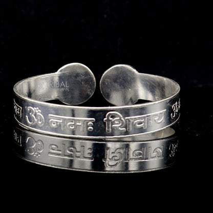 Handmade 925 sterling silver "Aum Namah Shivay" mantra cuff bracelet by Tribal Ornaments, featuring intricate design and divine symbolism.