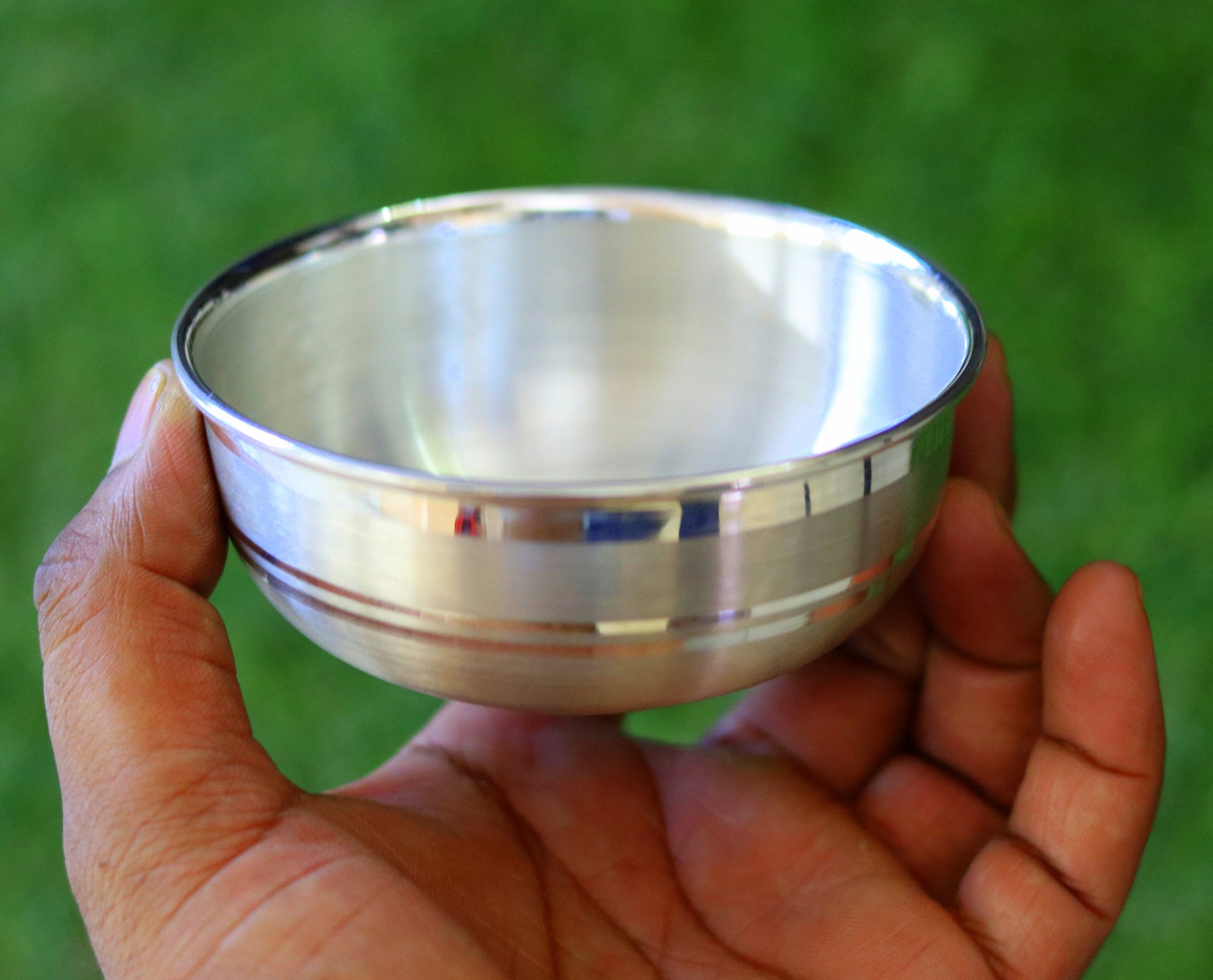 Handmade pure 999 fine silver bowl from India, high-quality silver kitchen utensil with a plain, polished finish.