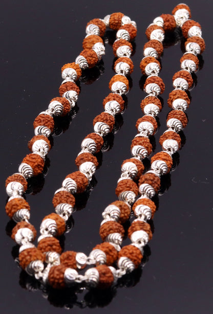 Handmade silver caps with natural rudraksha beads on a chain, unisex tribal jewelry with an intricate design.