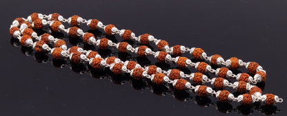 Handmade silver necklace with natural Rudraksha bead caps, unisex design, tribal jewelry by TRIBAL ORNAMENTS.