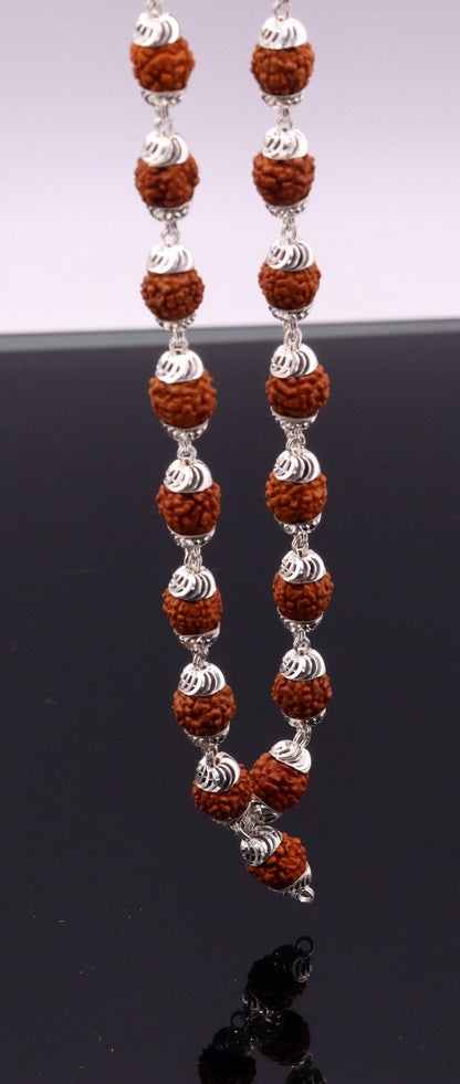 Handmade silver caps and natural rudraksha bead chain necklace, unisex tribal jewelry with an elegant design.