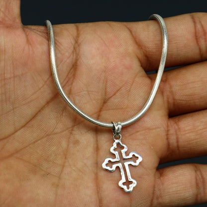 Sterling silver cross pendant by TRIBAL ORNAMENTS, stylish unisex jewelry with intricate design, perfect personalized gift accessory.