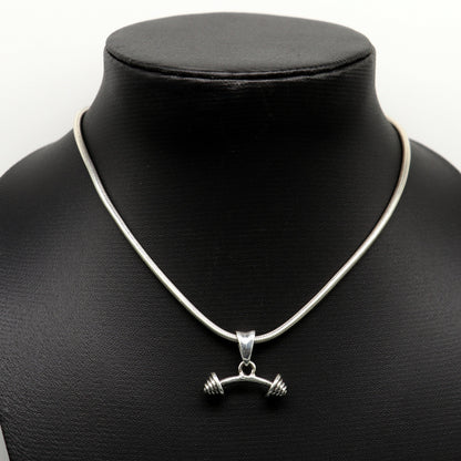 Sterling silver dumbbell pendant by TRIBAL ORNAMENTS, stylish unisex jewelry with detailed handmade design from India.