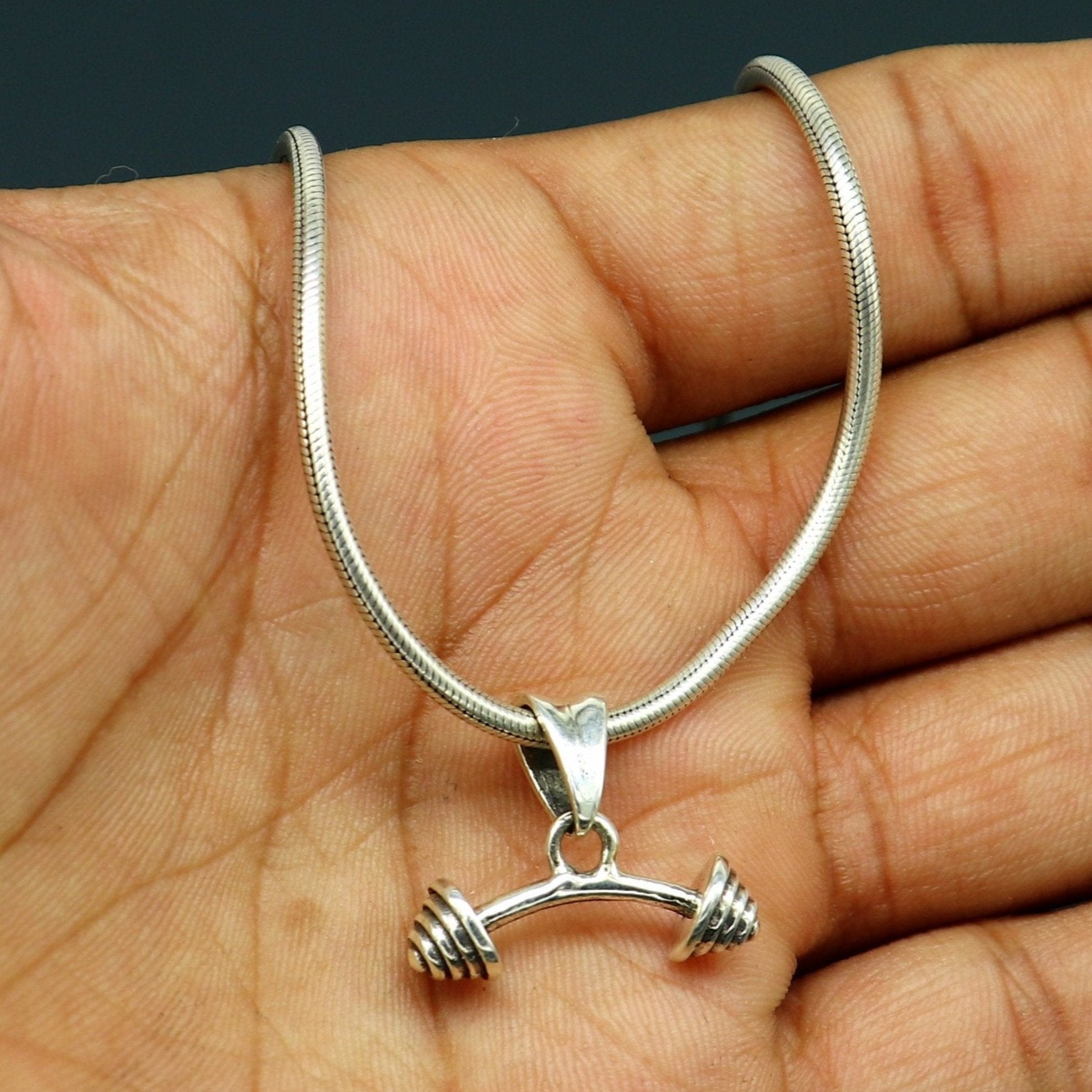 925 sterling silver Dumbbell pendant from TRIBAL ORNAMENTS, stylish unisex jewelry with unique handmade design.