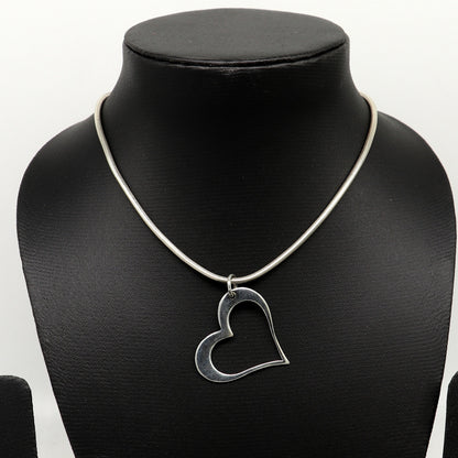 Sterling silver heart pendant by Tribal Ornaments, stylish unisex jewelry with a unique handmade design and personalized touch.