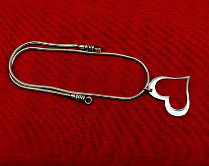 Sterling silver heart pendant by Tribal Ornaments, stylish unisex jewelry with unique handmade design, perfect personalized gift.