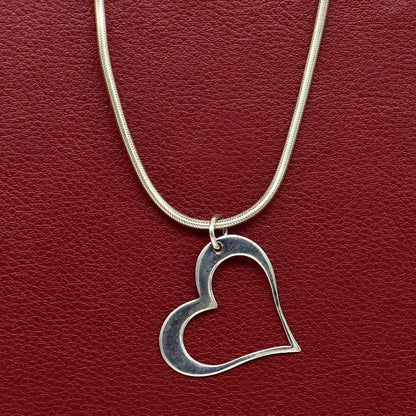 Sterling silver heart pendant by Tribal Ornaments, stylish unisex jewelry with a handcrafted design, perfect for personalized gifts.