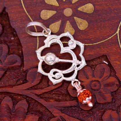 Sterling silver Aum mantra Rudraksha pendant from TRIBAL ORNAMENTS, vintage designer jewelry with intricate craftsmanship.