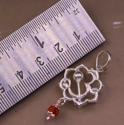 Sterling silver Aum mantra Rudraksha pendant from vintage designer jewelry by TRIBAL ORNAMENTS featuring intricate craftsmanship.