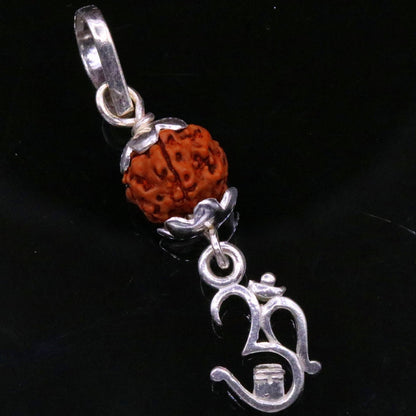 Sterling silver Aum mantra Rudraksha pendant from TRIBAL ORNAMENTS, vintage designer jewelry handcrafted in India.