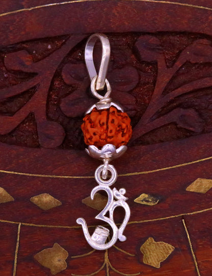 Sterling silver Aum mantra Rudraksha pendant, vintage designer jewelry with intricate craftsmanship from India.
