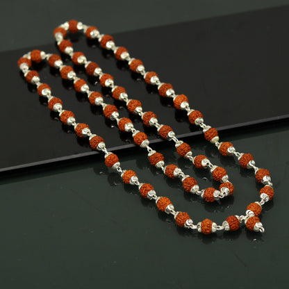 Handmade sterling silver Rudraksh mala necklace with 54 natural beads, 26 inches long, used for chanting and prayer.