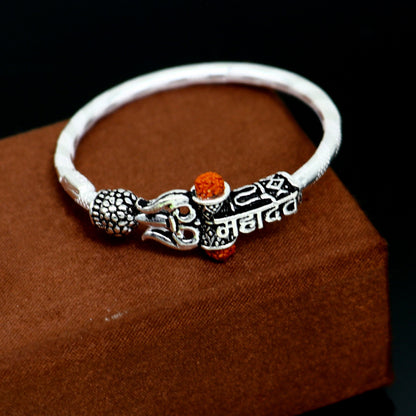 Handmade vintage silver baby bangle with Lord Shiva Mahadeva design, customized tribal ornament bracelet for gifting.