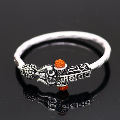 Handmade vintage silver baby bangle with Lord Shiva Mahadeva design, customized tribal ornament bracelet for gifting.
