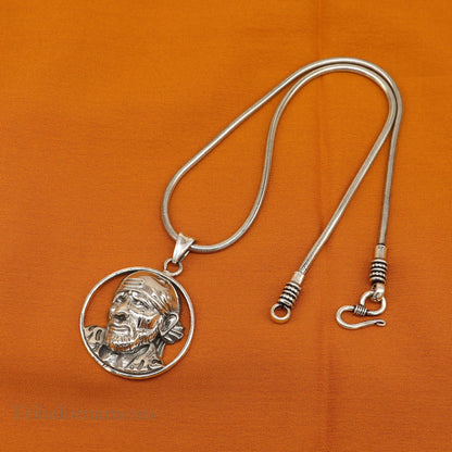 Sterling silver Sai Baba pendant by TRIBAL ORNAMENTS, unisex personalized jewelry featuring intricate tribal design.
