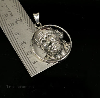 Sterling silver Sai Baba pendant, unisex handmade jewelry by Tribal Ornaments, featuring detailed idol design and personalized style.