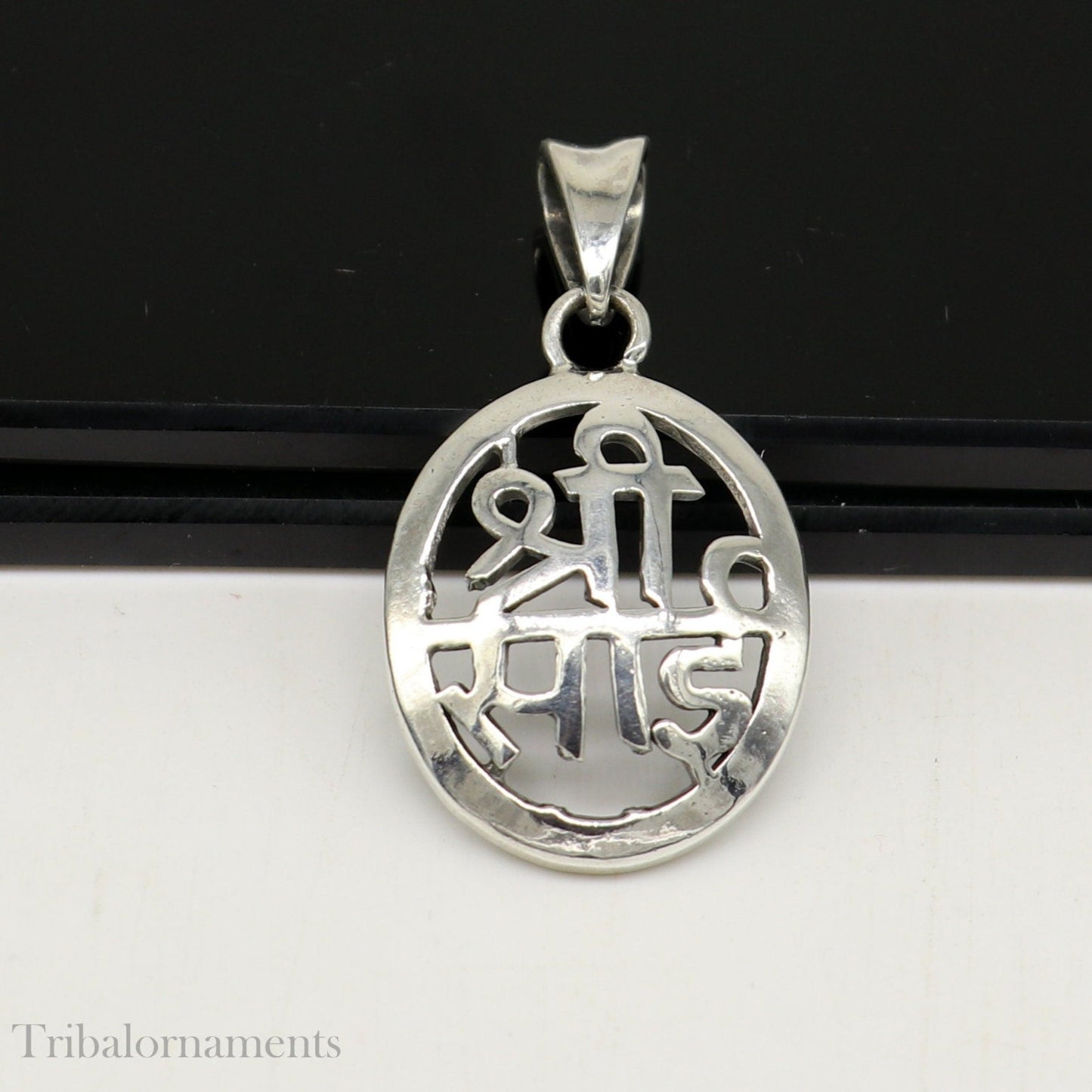 Handmade 925 sterling silver Shree Sai idol pendant necklace, personalized tribal jewelry with intricate divine design.