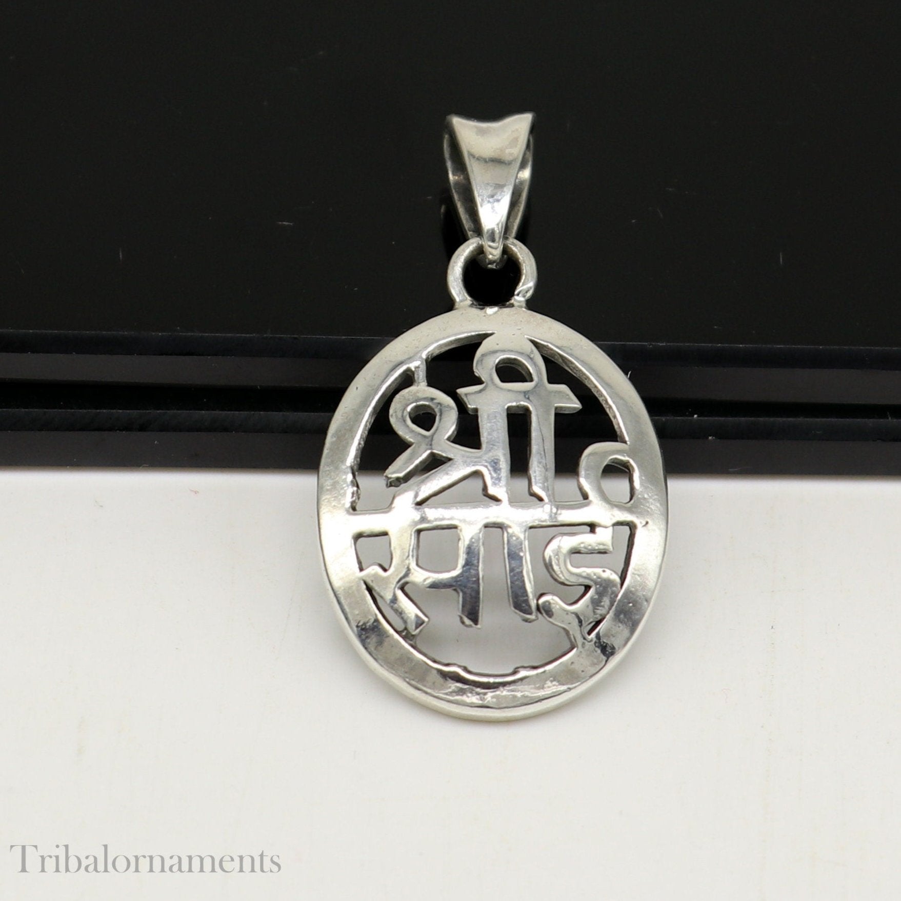 Handmade 925 sterling silver Shree Sai idol pendant necklace, personalized tribal jewelry with intricate divine design.