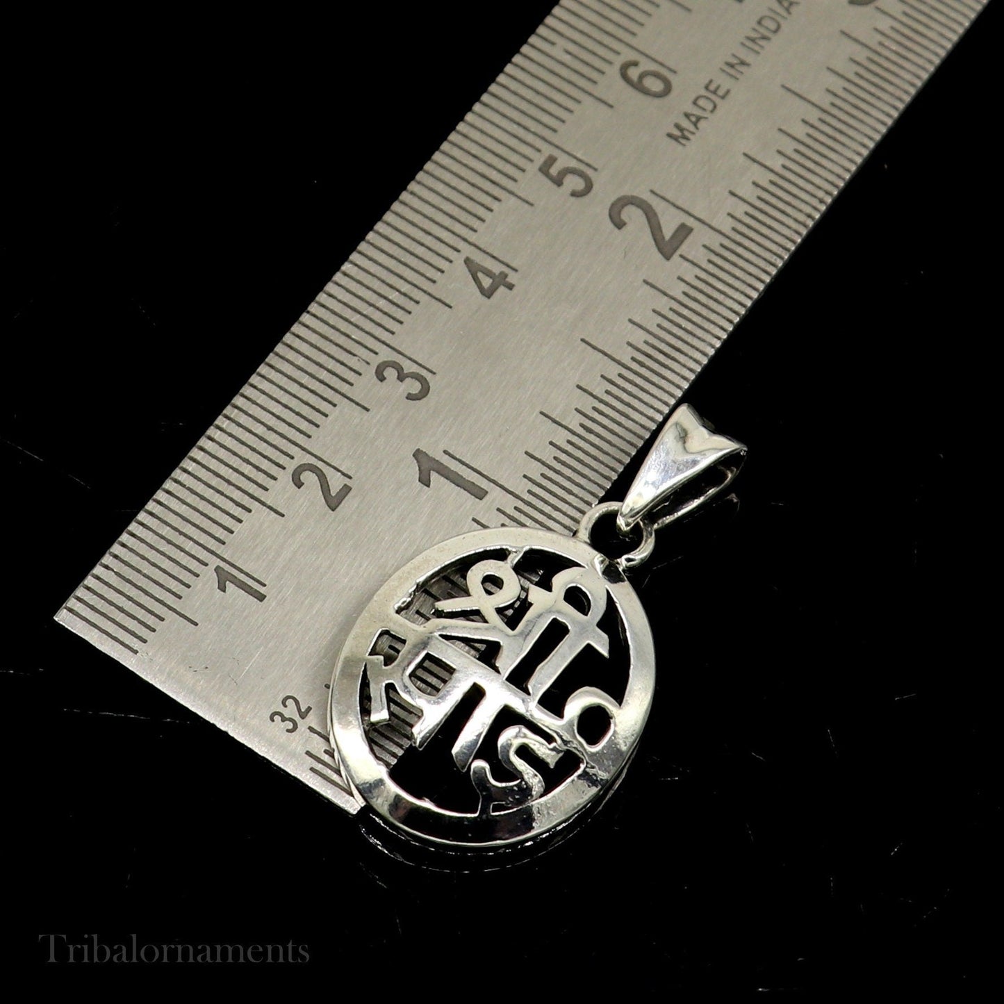 925 sterling silver Shree Sai idol pendant, handmade tribal jewelry featuring a divine Sai Baba design and personalized style.