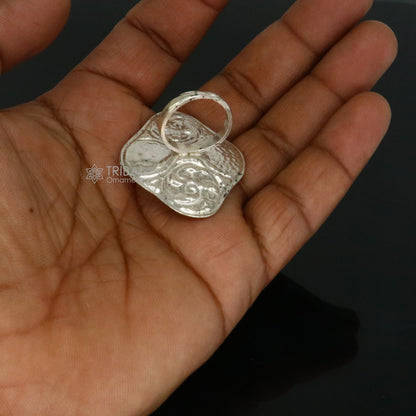 Sterling silver Indian classical tribal ring with floral design, adjustable band, suitable for Navratri and ethnic jewelry styles.