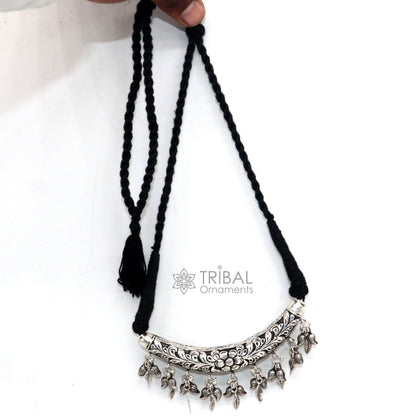 Indian traditional tribal jewelry set featuring a 925 sterling silver customized Kandrai charm necklace, hasali, and choker.