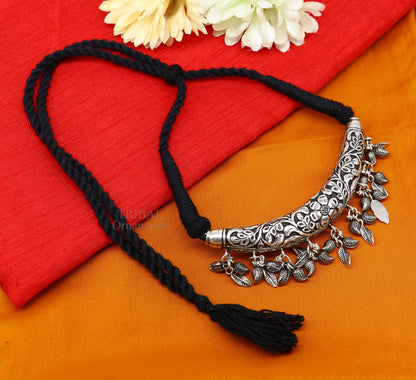 Indian traditional tribal silver choker necklace with Kandrai charm and intricate customized work, part of a tribal jewelry set.