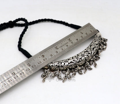Indian traditional tribal silver necklace with kandrai charm, hasali and choker style, featuring intricate tribal jewelry design.