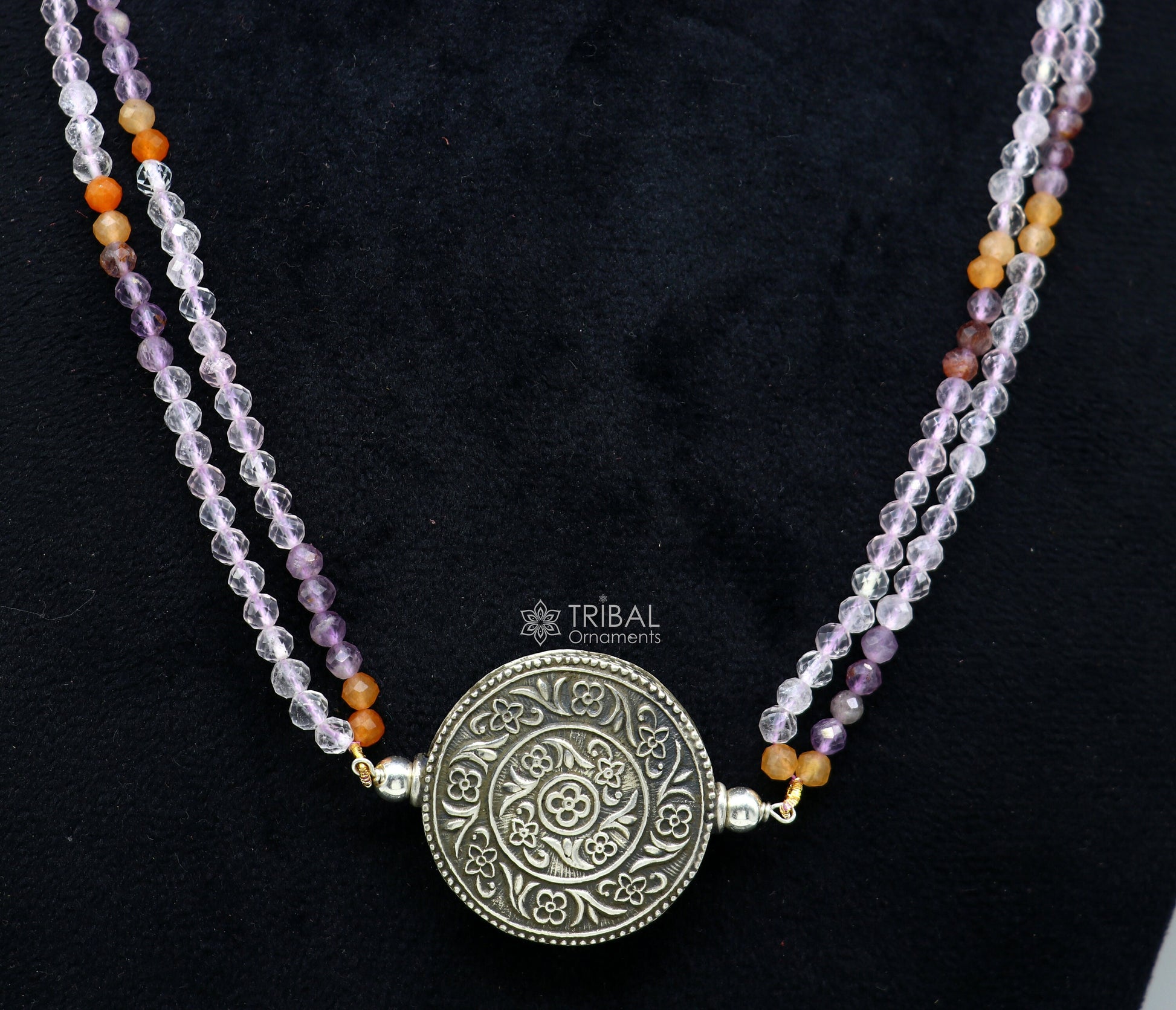 Indian tribal-style beaded silver necklace with multicolor stones, featuring a traditional choker design and ethnic jewelry set.