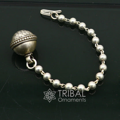 Vintage Indian mangtika hair jewelry in 925 sterling silver with intricate tribal and ethnic design for traditional cultural attire.
