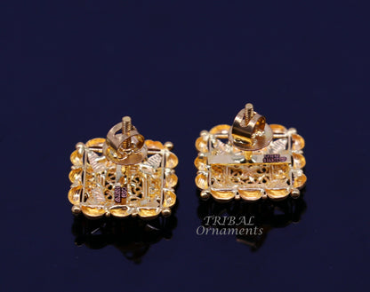 Indian traditional handmade 22K yellow gold flower design stud earrings for women, featuring intricate hand-carved craftsmanship.