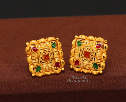 Hand-carved Indian traditional flower design 22K yellow gold stud earrings for women, showcasing intricate craftsmanship.