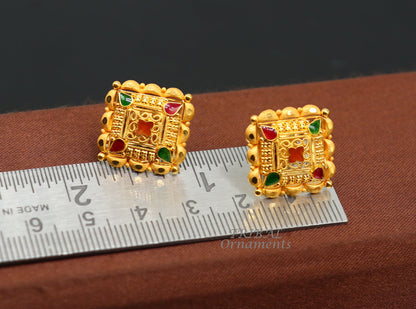 Indian handmade flower design 22K yellow gold stud earrings for women, featuring intricate hand-carved floral details by Tribal Ornaments.
