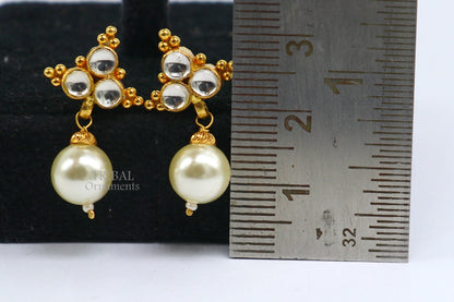 Indian handmade Kundan work 22K yellow gold stud earrings with hanging pearl, showcasing traditional craftsmanship and elegant design.