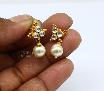 Indian traditional handmade Kundan work 22kt yellow gold stud earrings with hanging pearl, showcasing intricate craftsmanship.