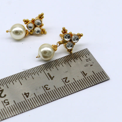 Indian traditional handmade Kundan work 22KT yellow gold stud earrings with hanging pearls, intricate design and craftsmanship.
