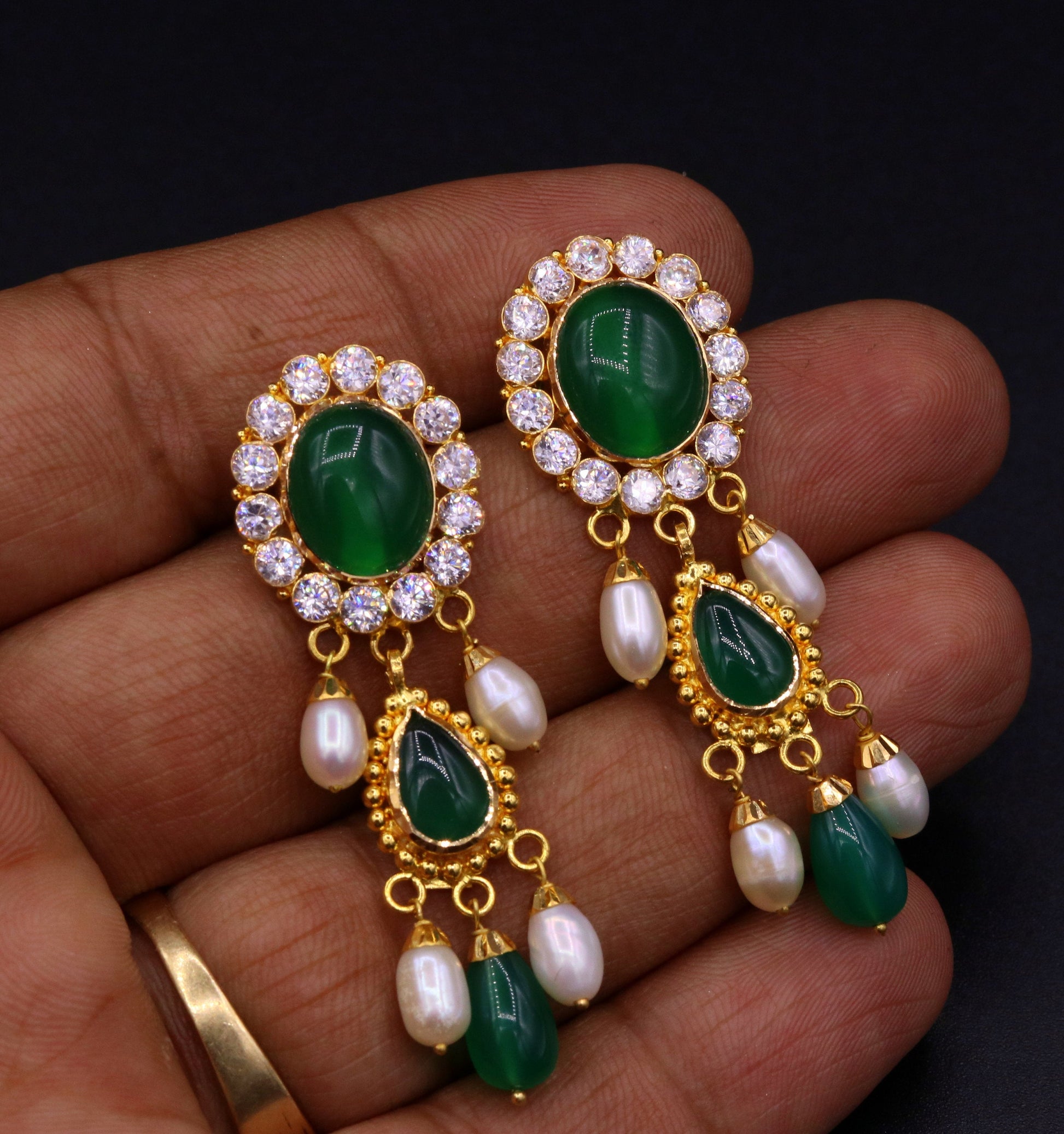 Fabulous green stone handmade Indian earrings in 22K yellow gold with dangling tribal jewelry style from Rajasthan.