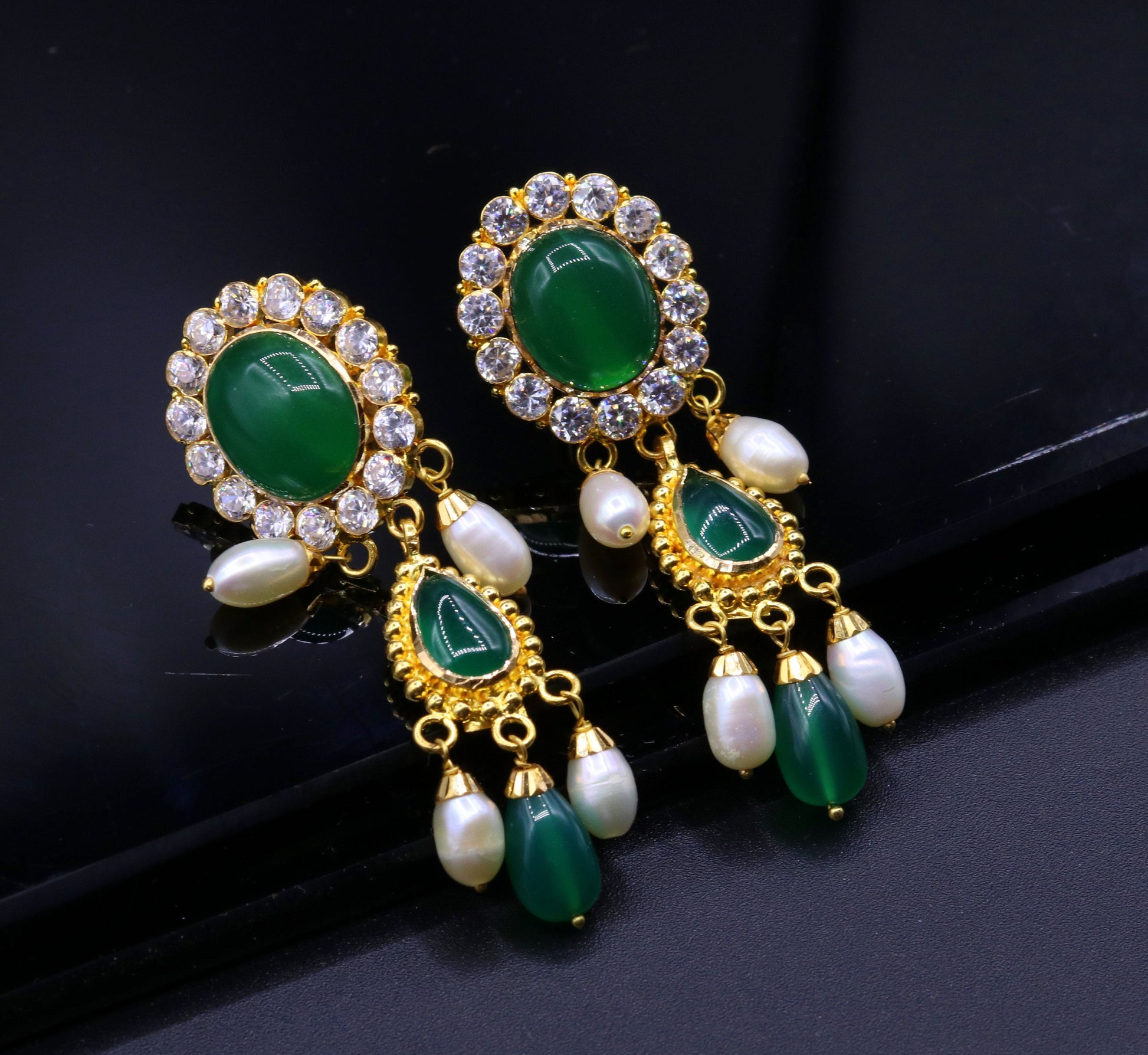 Handmade Indian tribal earrings with green stones, dangling 22k yellow gold, traditional Rajasthan style jewelry by Tribal Ornaments.