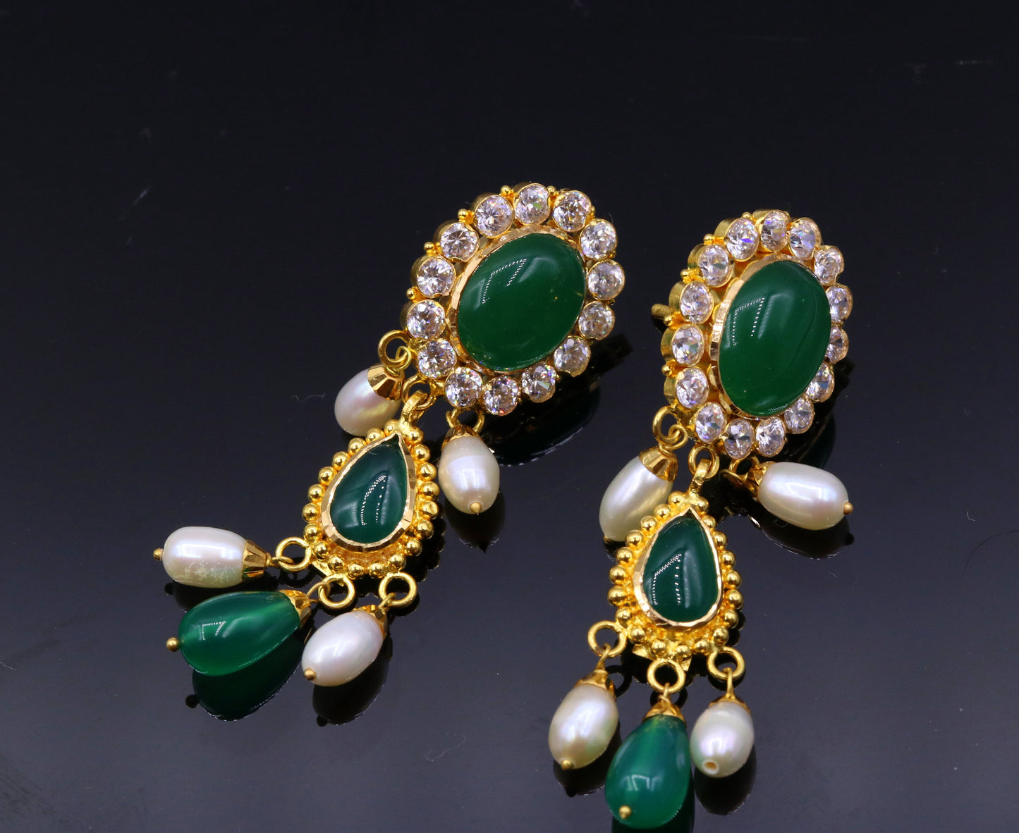 Handmade Indian tribal earrings with green stones, 22k yellow gold, traditional Rajasthan style, dangling tribal jewelry.