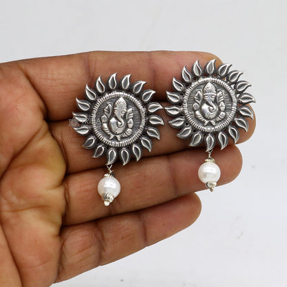 Sterling silver Lord Ganesha stud earrings with tribal design from Rajasthan India, handmade by TRIBAL ORNAMENTS.