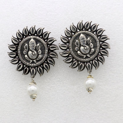 Sterling silver Lord Ganesha stud earrings featuring handmade tribal Ganesha design from Rajasthan India.