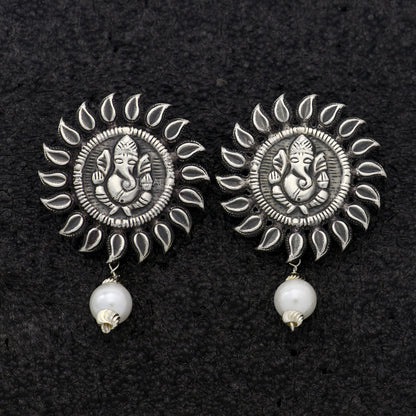Sterling silver Lord Ganesha stud earrings featuring handmade tribal design, from Rajasthan, India.