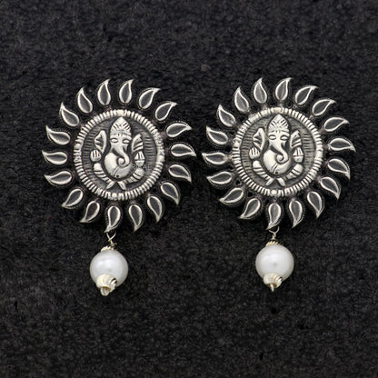 Handmade Lord Ganesha sterling silver stud earrings with tribal design from Rajasthan, featuring intricate Ganesha motifs.