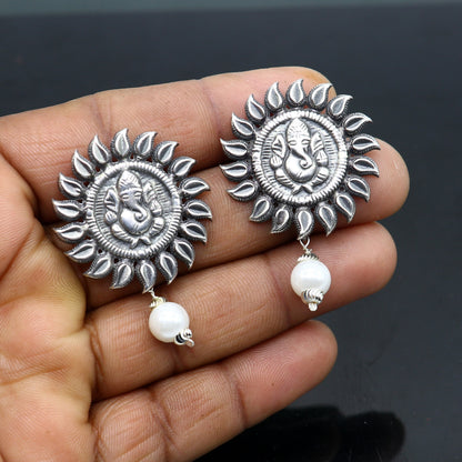 Sterling silver Lord Ganesha stud earrings featuring handmade tribal design from Rajasthan India, crafted by TRIBAL ORNAMENTS.